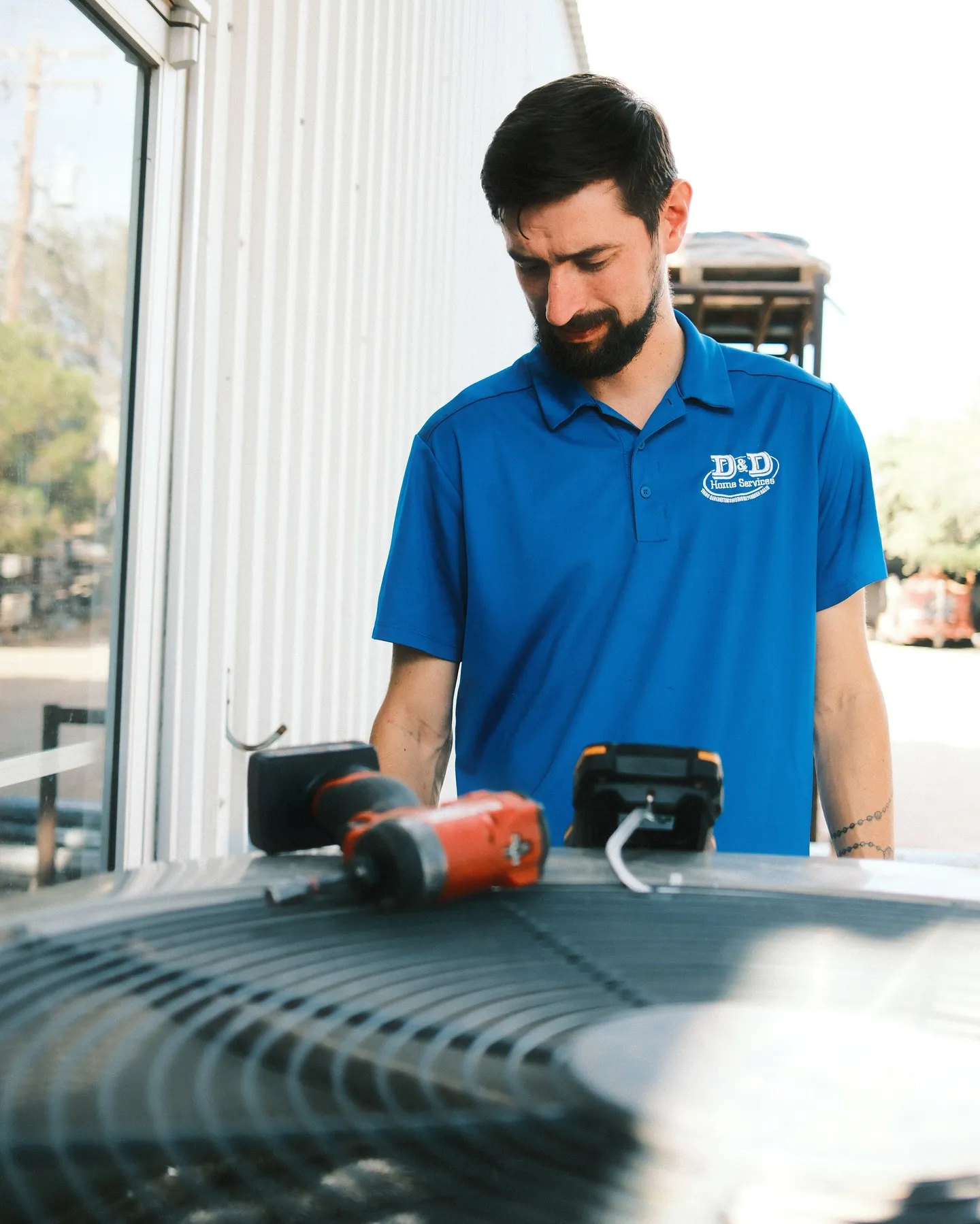 D&D HVAC technician working on a residential system