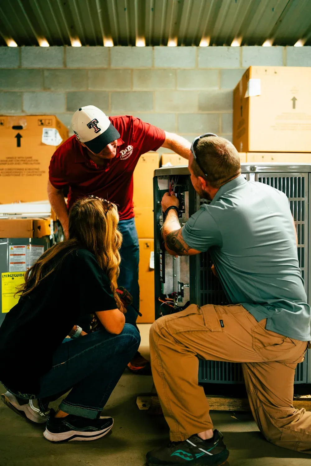 D&D HVAC technician servicing equipment