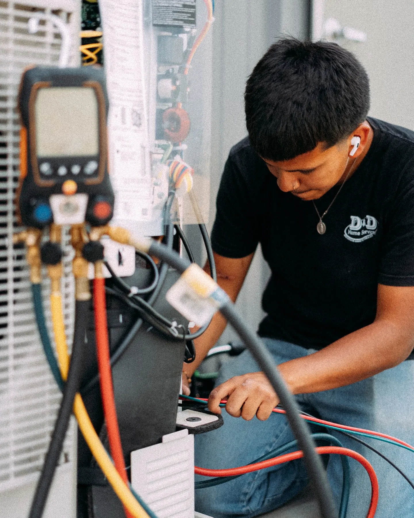 D&D technician diagnosing an HVAC issue