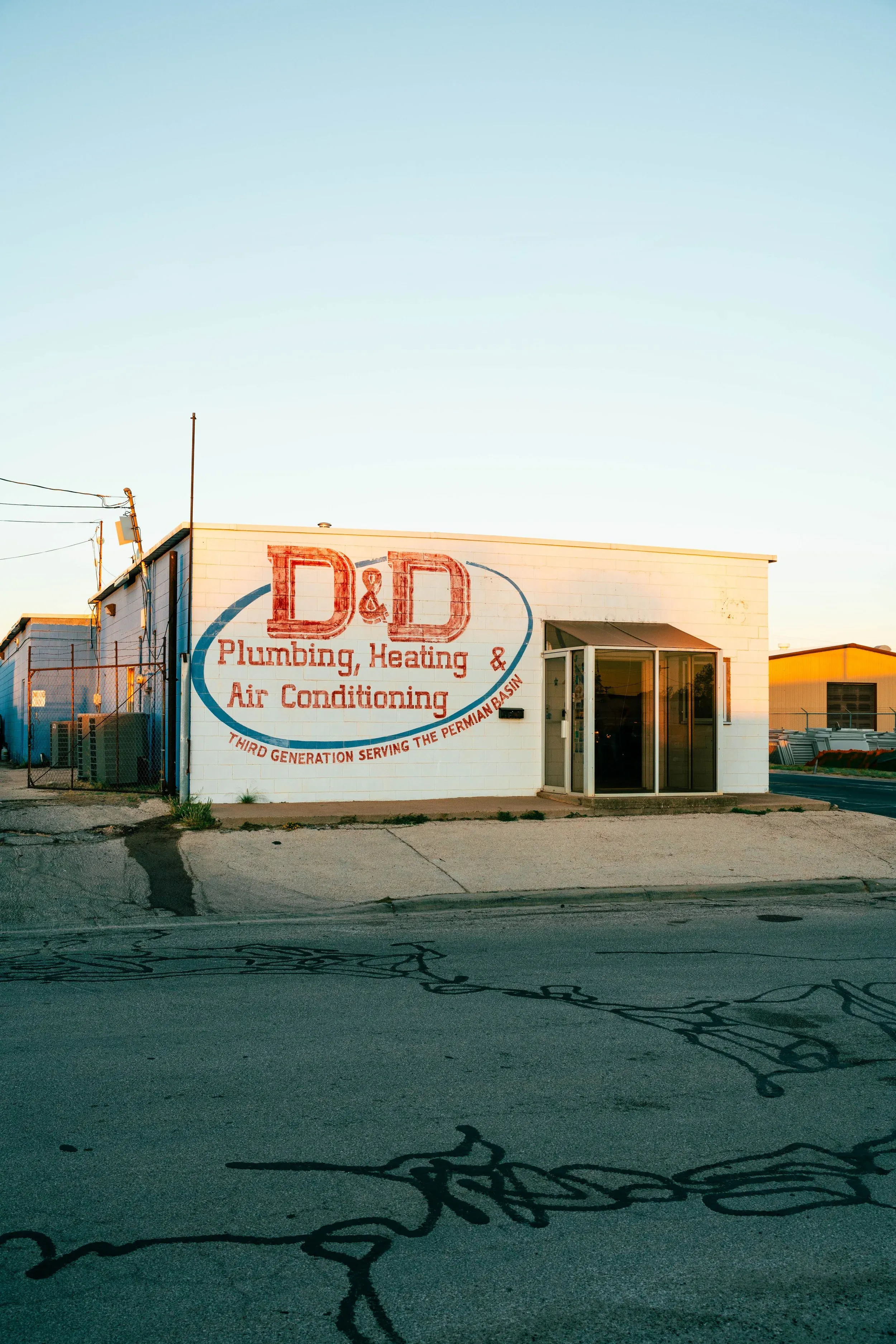 D&D Home Services storefront in Midland, Texas at sunset