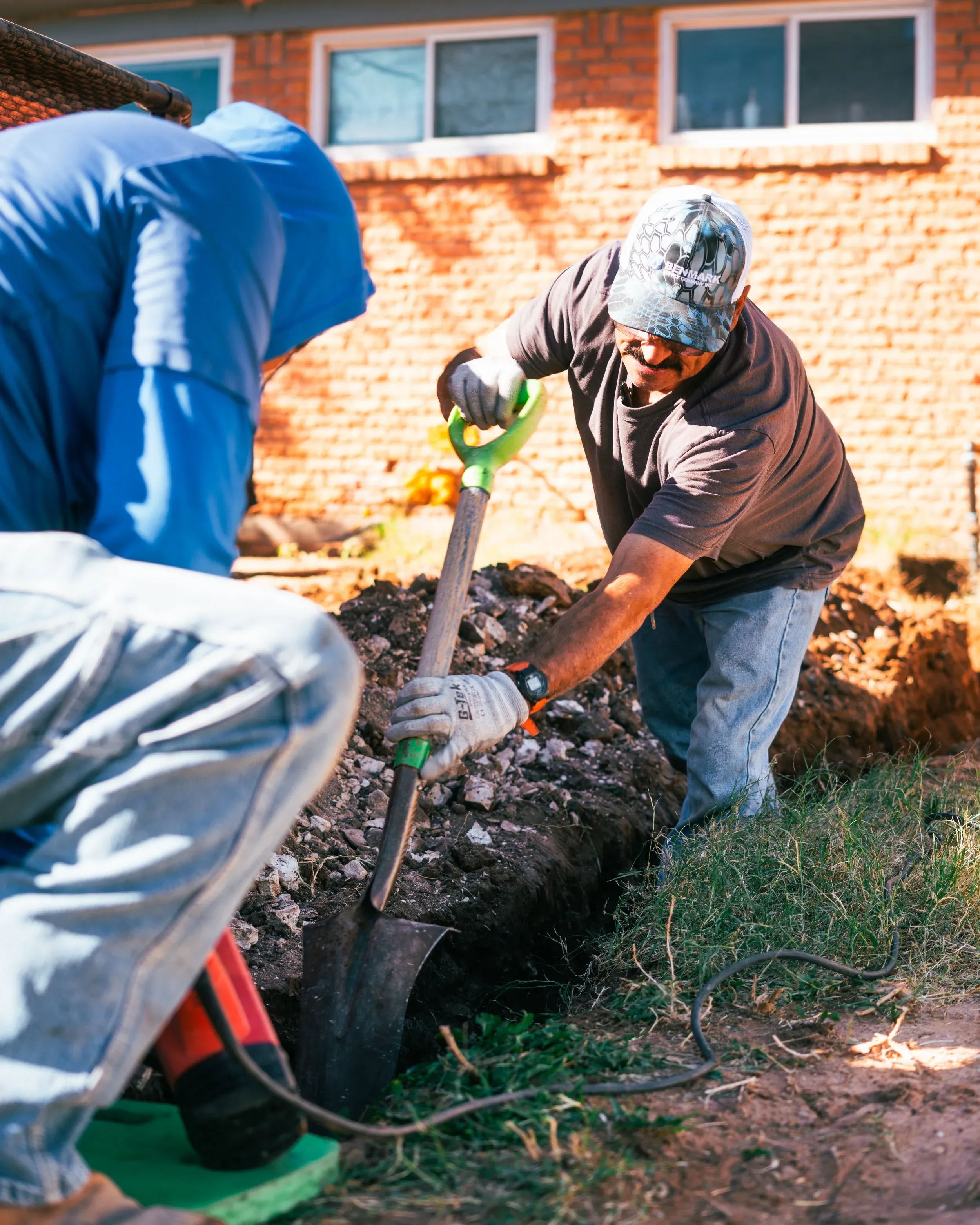 D&D crew digging a trench for sewer repair