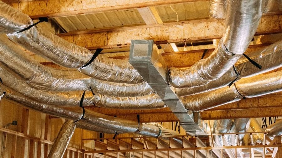 Exposed HVAC ductwork installed in a residential attic, designed to distribute conditioned air efficiently throughout the home.